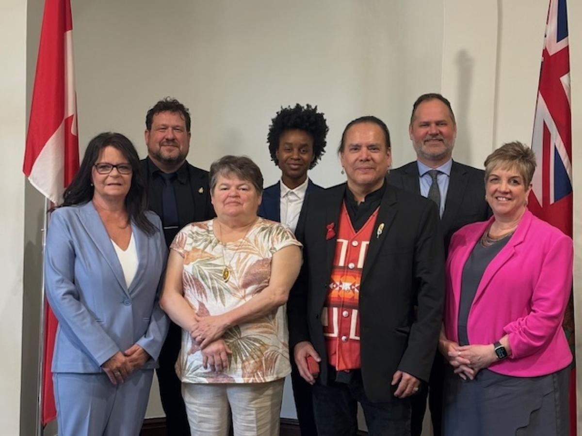 The NACC Presidents stands with six Manitoba Ministers at a Parliamentary meeting. 